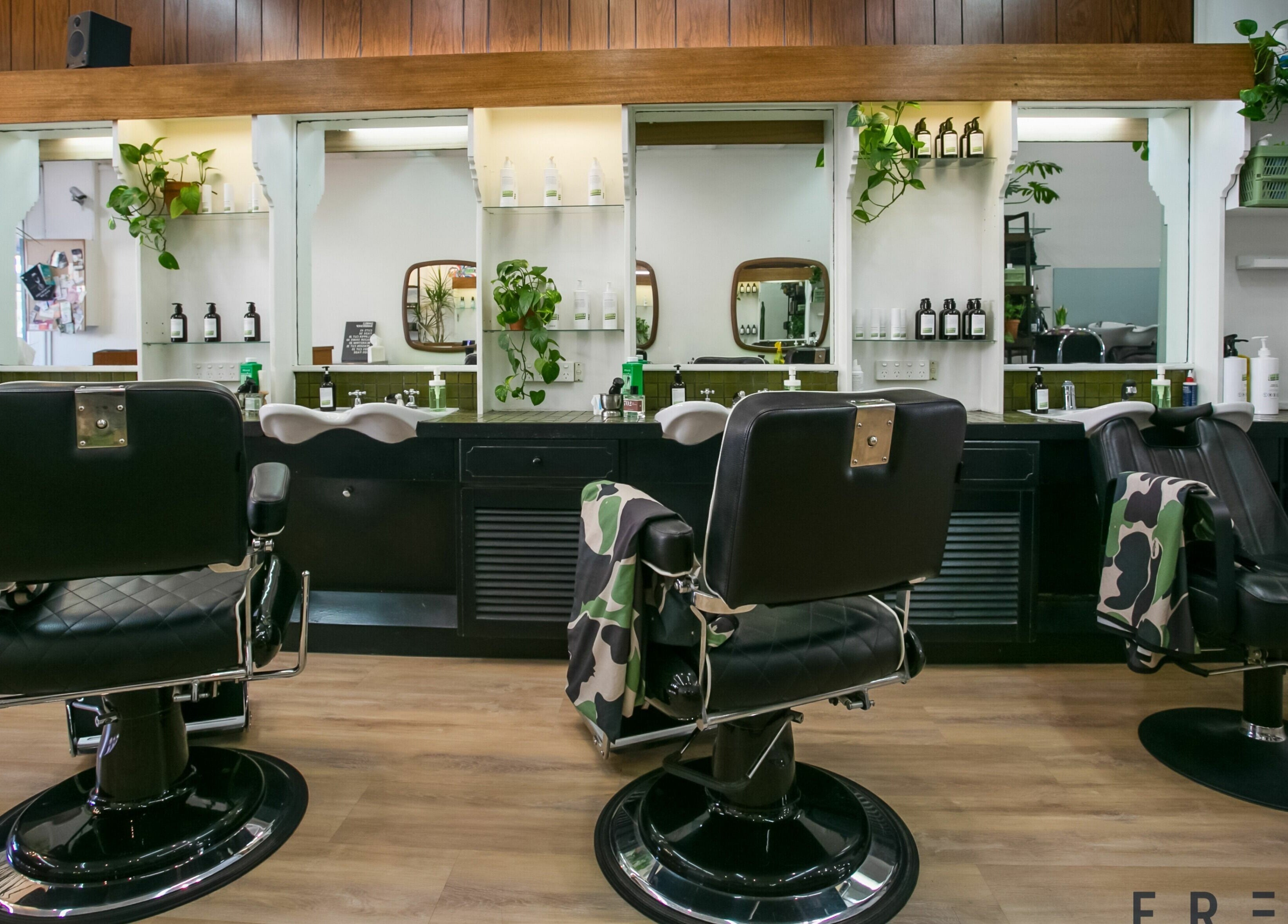 Stylish barber chairs at Daniel's Barbershop in Melbourne, Victoria, AU highlighting sleek interior and design.