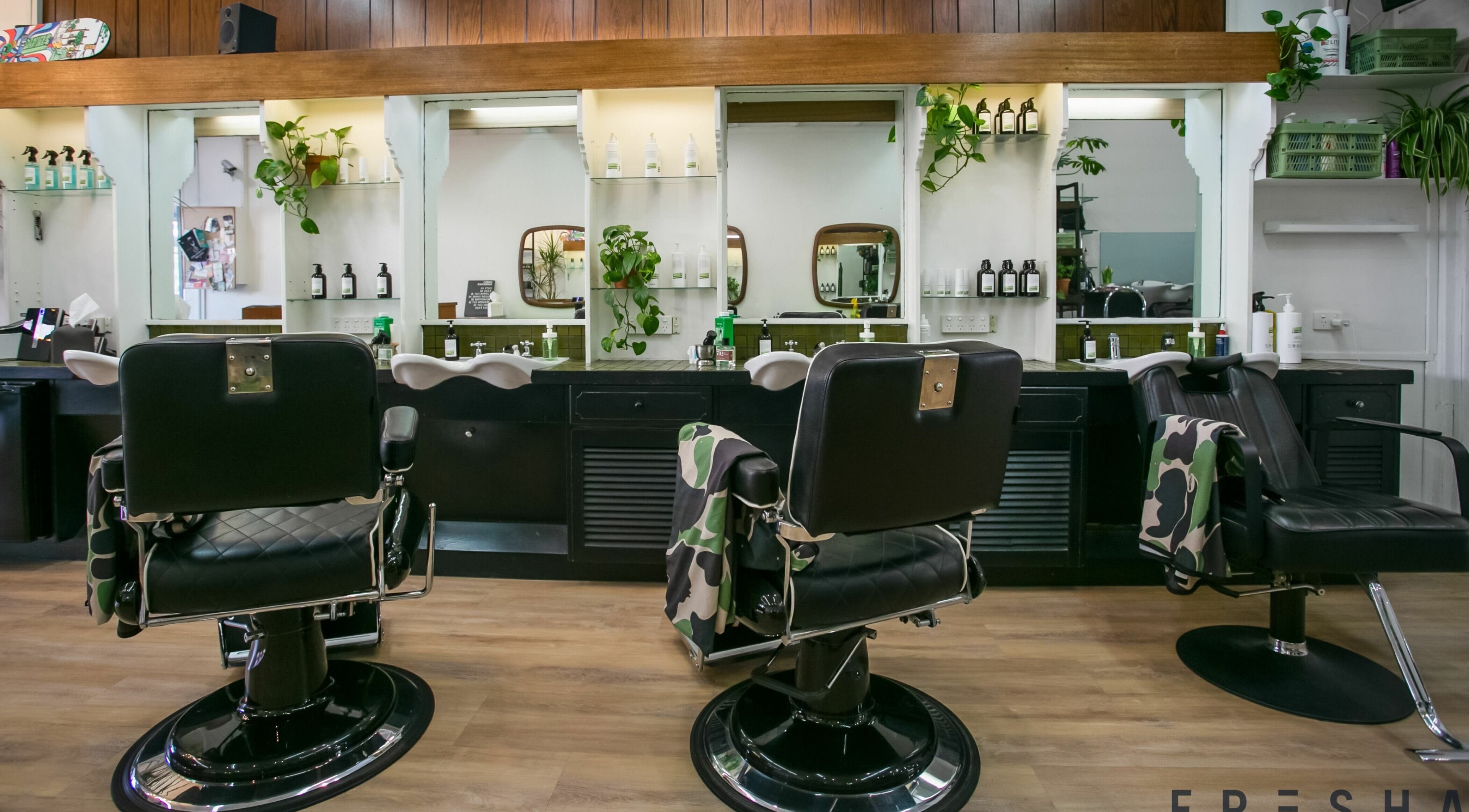 Stylish barber chairs at Daniel's Barbershop in Melbourne, Victoria, AU highlighting sleek interior and design.