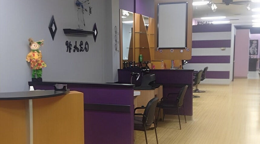 Interior view of Halo Salon And Medi Spa in Scranton, Pennsylvania, US featuring purple and wood decor.