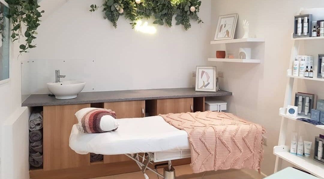 Tranquil treatment room at Coco Beauty in Belper, England, GB with plush bedding and elegant decor.