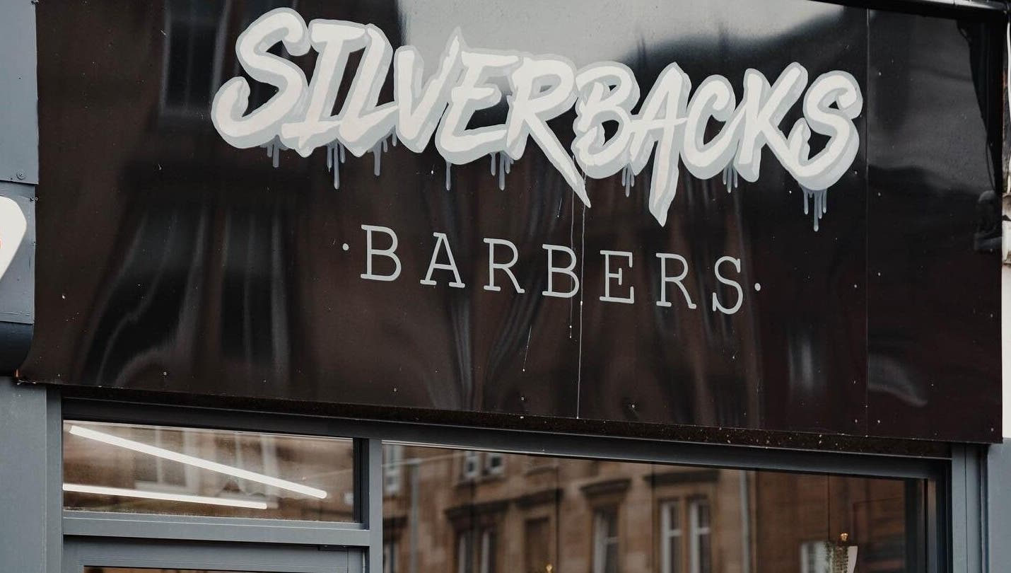 Silverbacks Barbers sign in Glasgow, Scotland, GB showcasing a modern and stylish design.