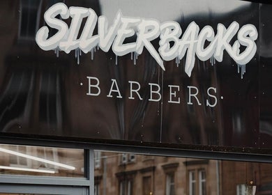 Silverbacks Barbers sign in Glasgow, Scotland, GB showcasing a modern and stylish design.