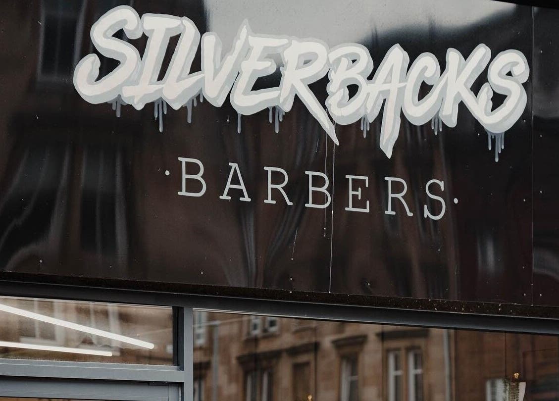 Silverbacks Barbers sign in Glasgow, Scotland, GB showcasing a modern and stylish design.