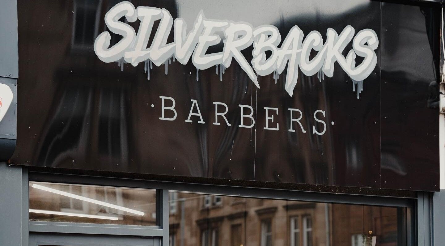 Silverbacks Barbers sign in Glasgow, Scotland, GB showcasing a modern and stylish design.