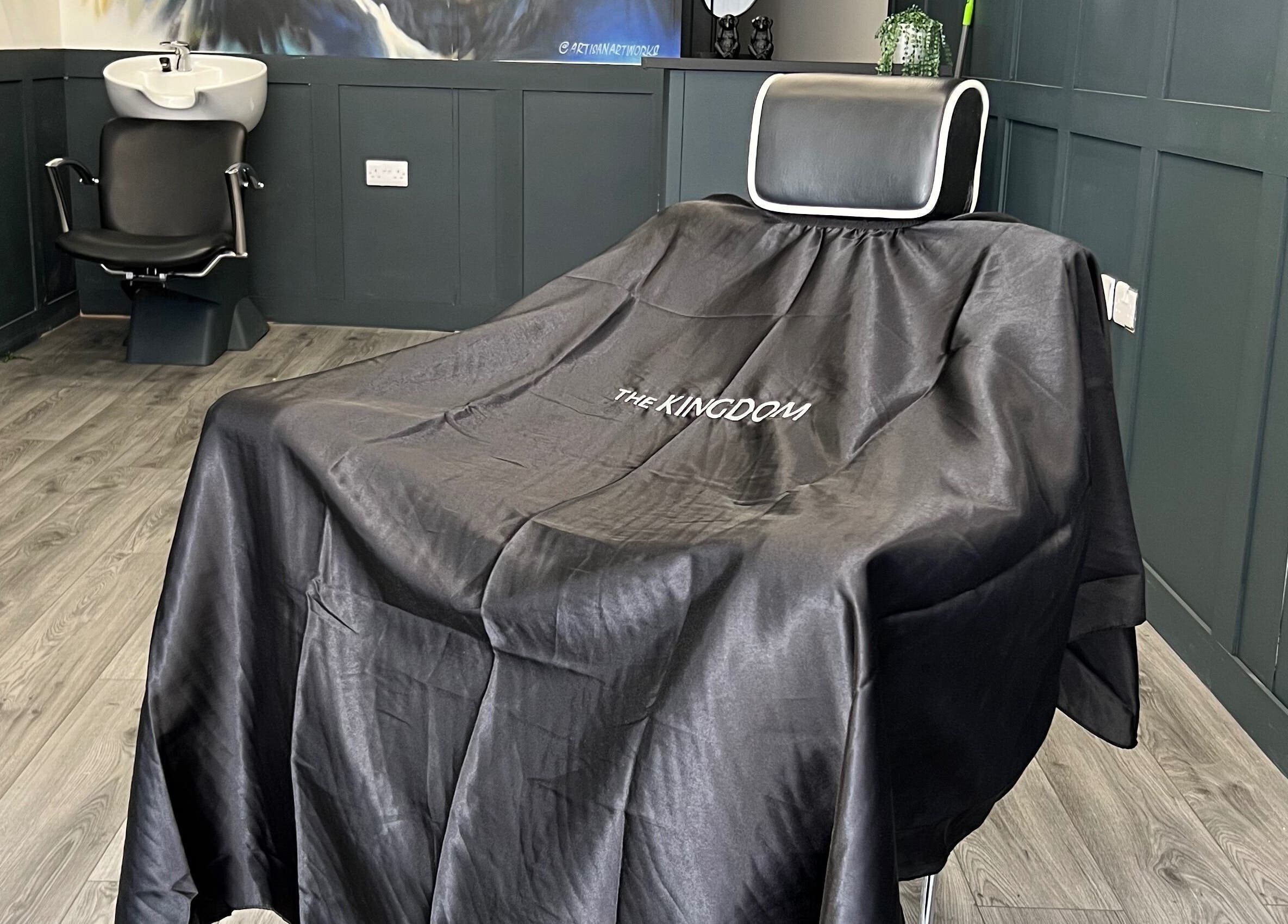 Modern barber chair at Silverbacks Barbers, Glasgow, Scotland, GB, showcasing sleek interior.