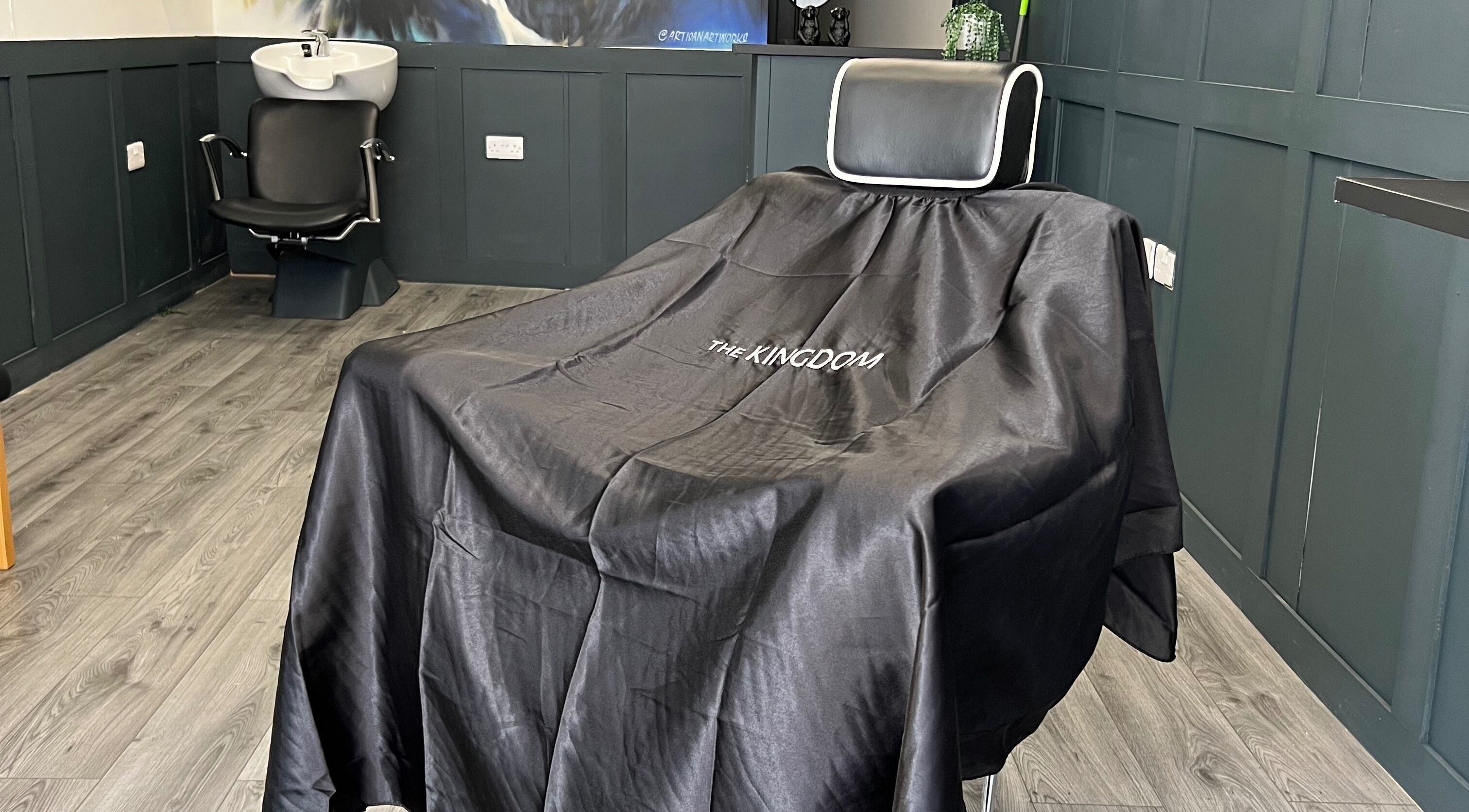 Modern barber chair at Silverbacks Barbers, Glasgow, Scotland, GB, showcasing sleek interior.