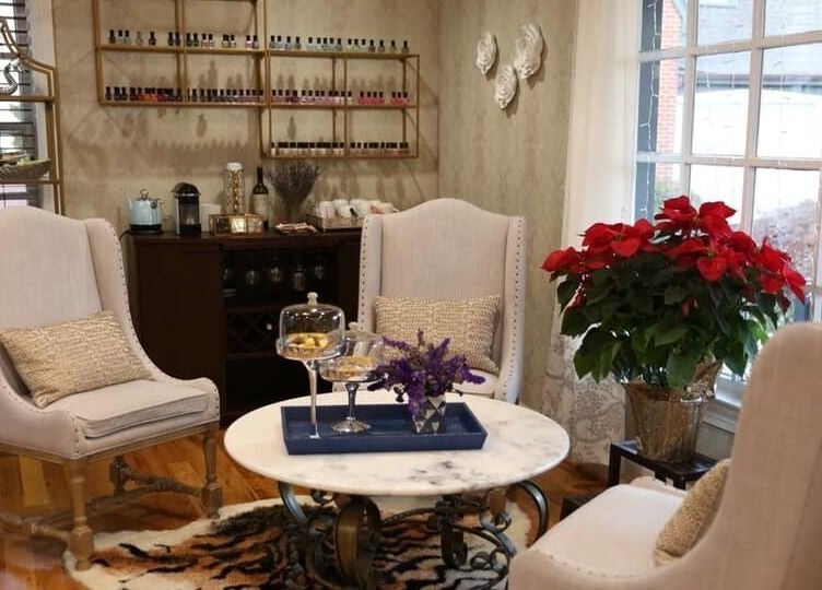 Elegant sitting area at My River Nails and Spa LLC in Great Falls, Virginia, US with chic decor and vibrant plants.