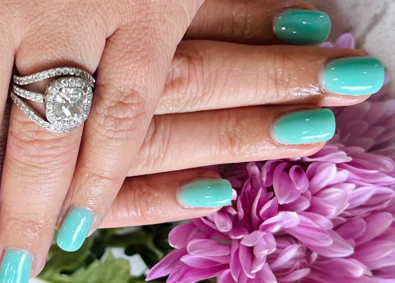Turquoise nails with diamond ring at My River Nails and Spa LLC, Great Falls, Virginia, US.