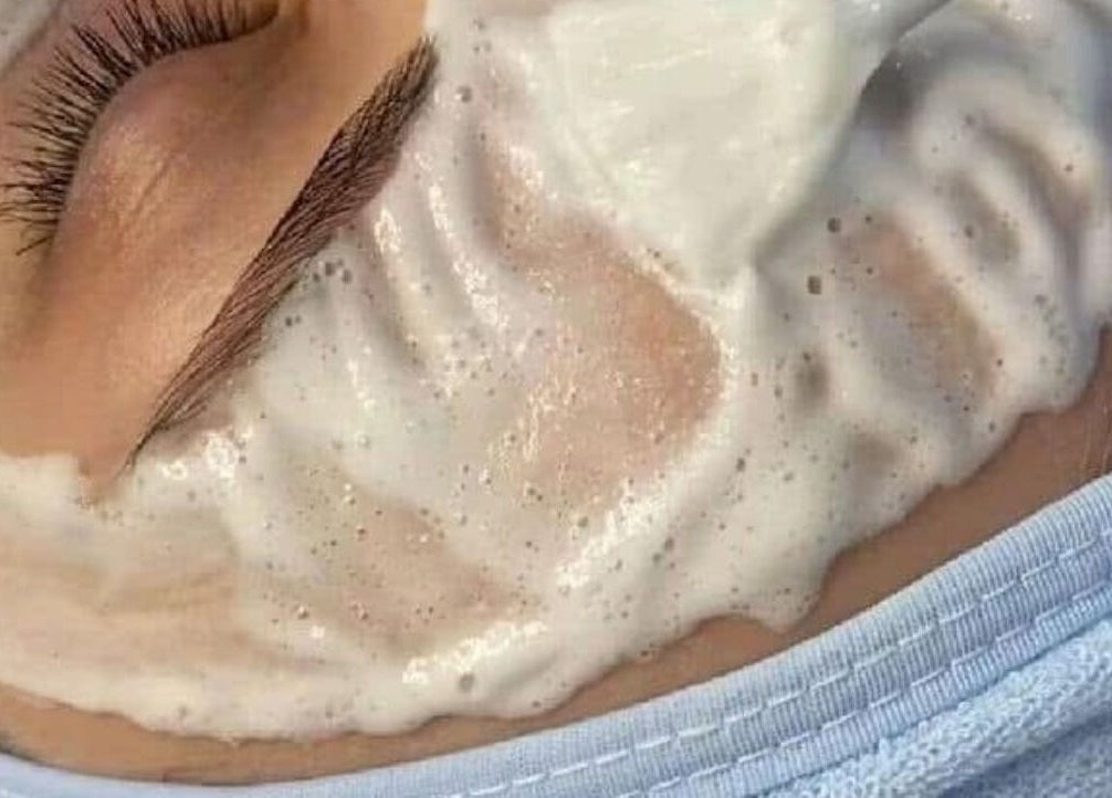 Relaxing facial treatment with foam at Salon 102 & Spa, West Greenwich, Rhode Island, US.