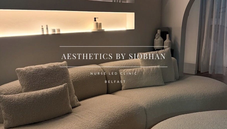 Cozy lounge at Aesthetics by Siobhan, Belfast, Northern Ireland with plush seating and ambient lighting.