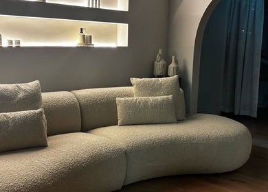 Elegant curved sofa in tranquil room at Aesthetics by Siobhan, Belfast, Northern Ireland, GB.