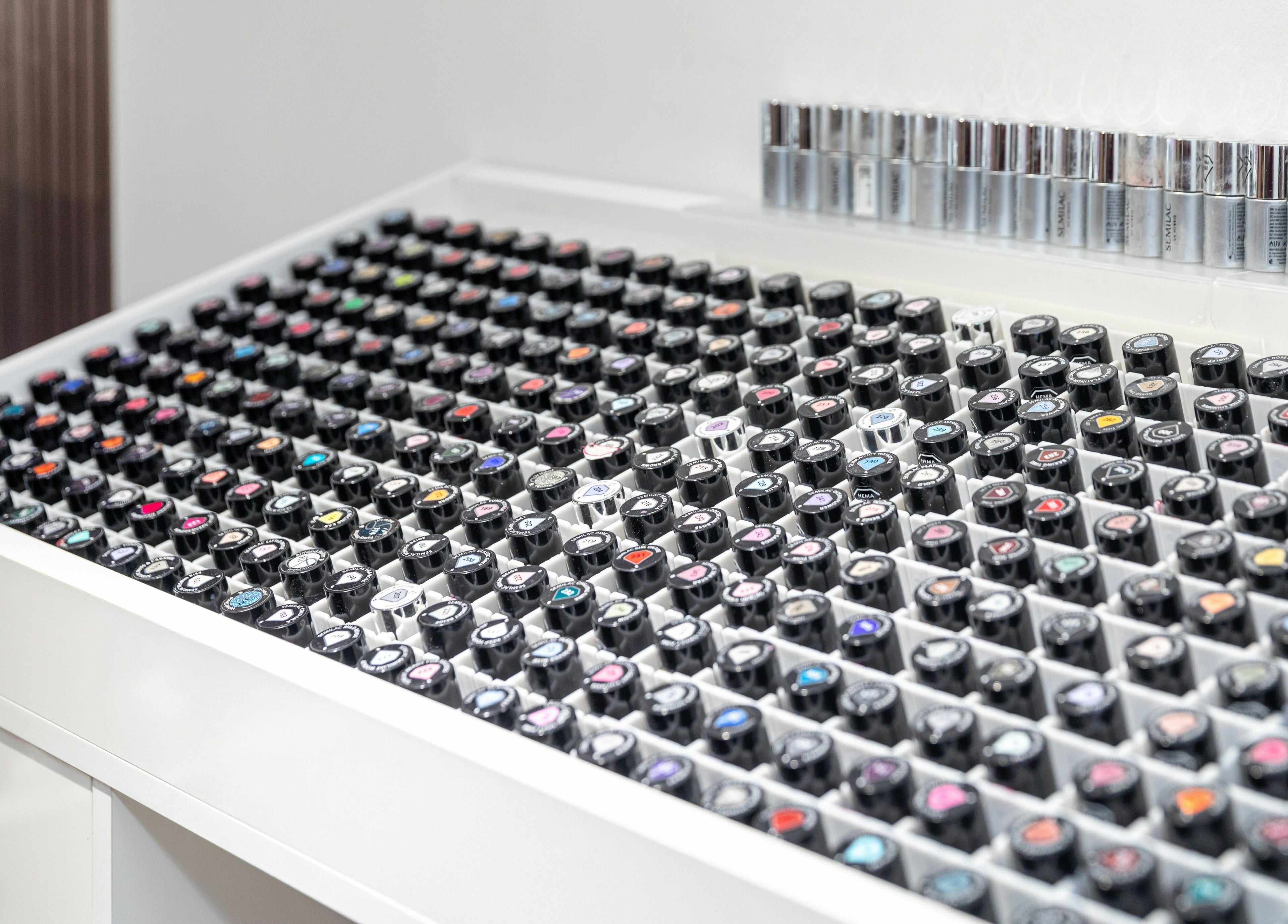 Vibrant polish display at Nail Lounge & Spa (London Rd Brighton), Brighton, England, GB. Explore colorful nail options.