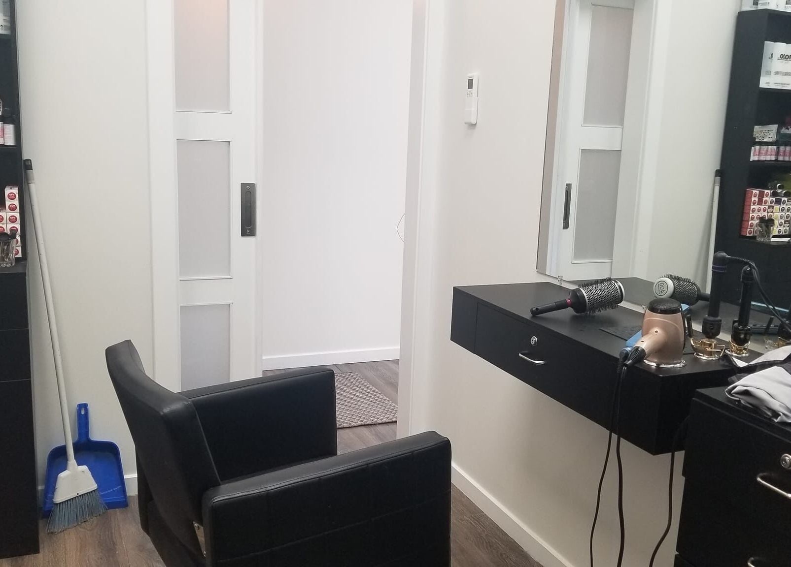 Modern salon setup at Seaside at Salon Suites by the Sea in Rockport, Maine, US featuring hair tools and products.