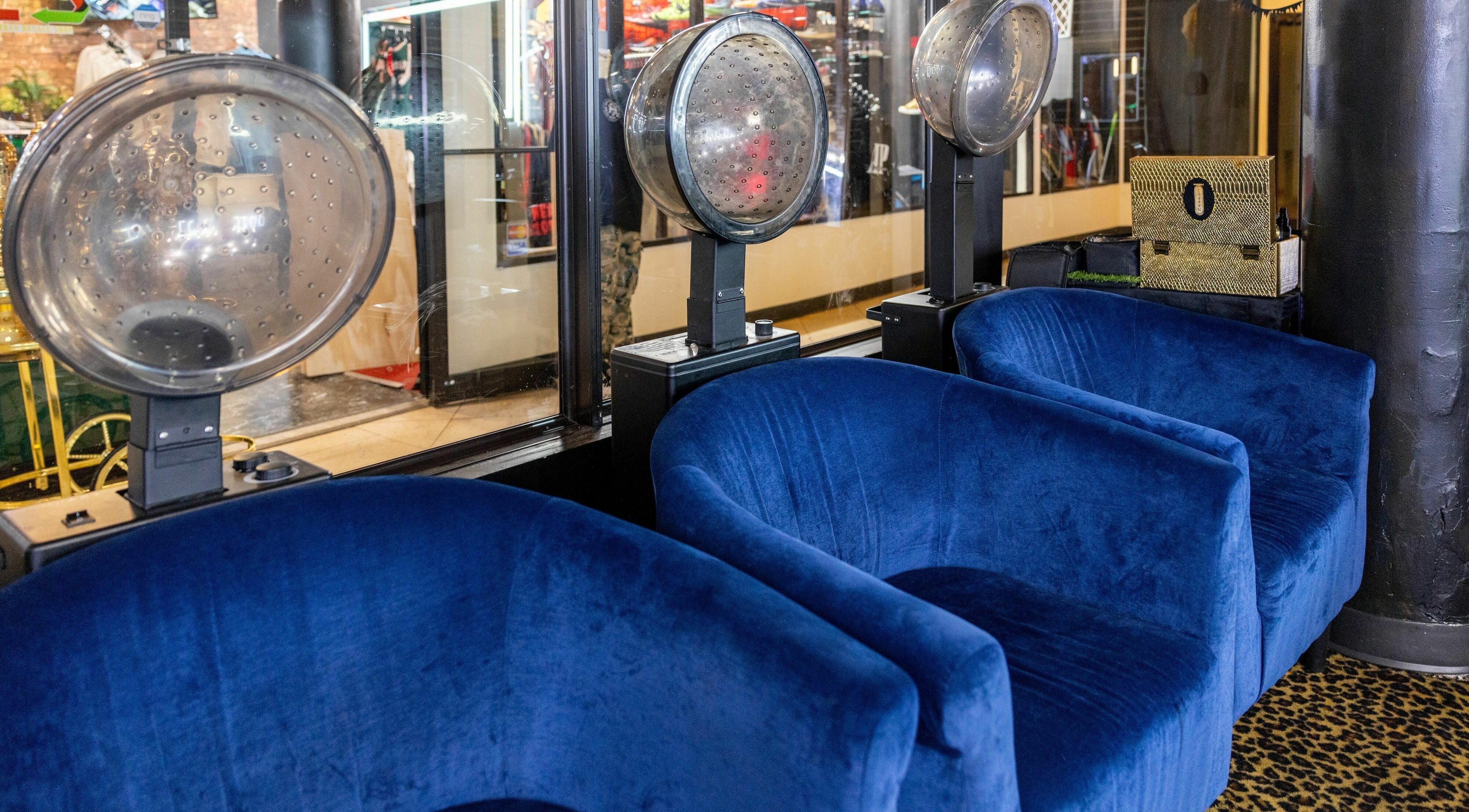 Modern blue seating at Napps Natural Hair Salon in St. Louis, Missouri, US, offering a stylish, relaxing ambiance.