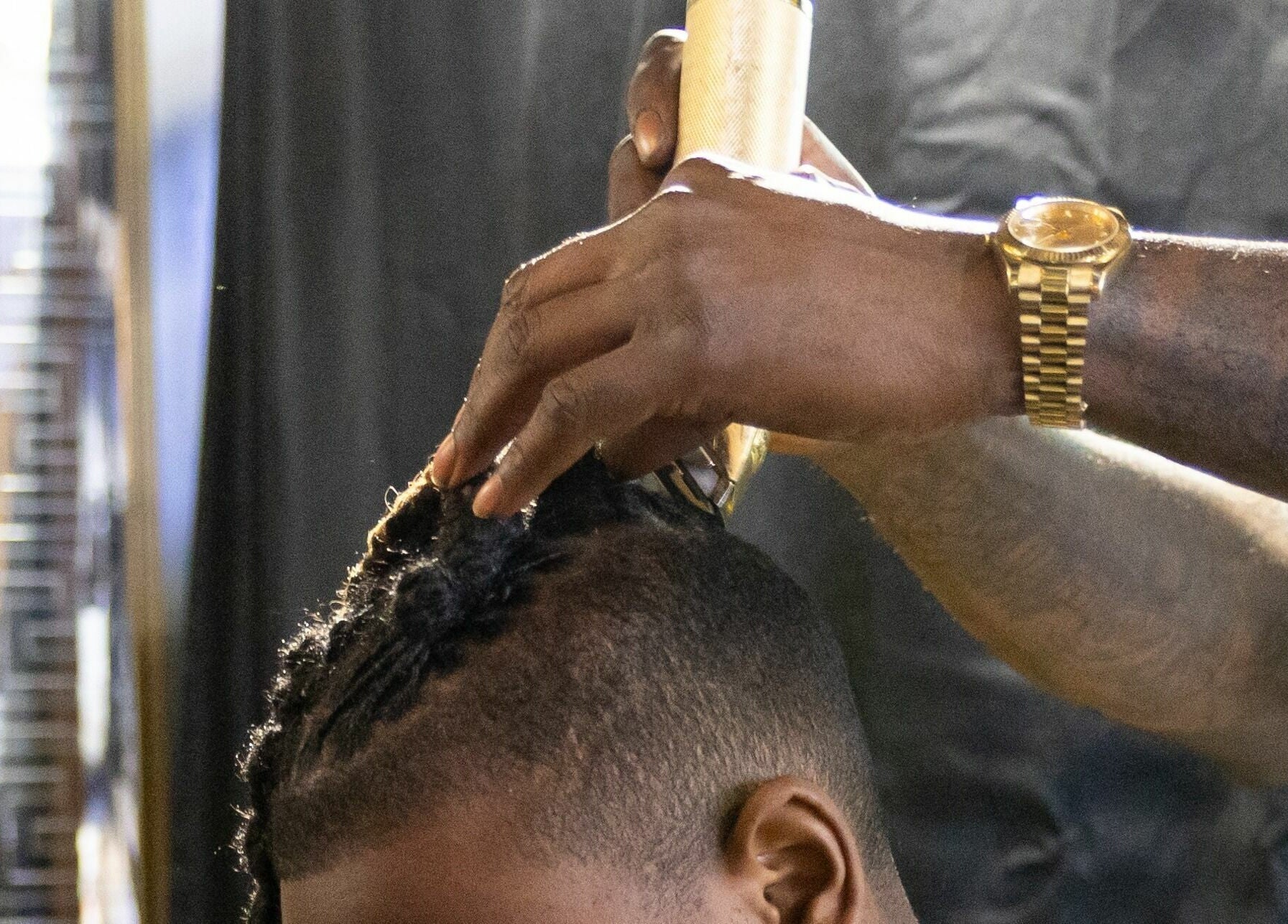 Expert braiding at Napps Natural Hair Salon in St. Louis, Missouri, US, showcasing detailed styling.