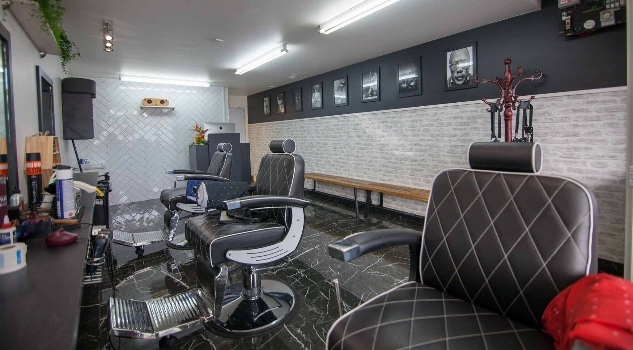 Modern barber chairs at Mo Town Barber Studio, Christchurch, Canterbury, NZ showcasing sleek interior design.