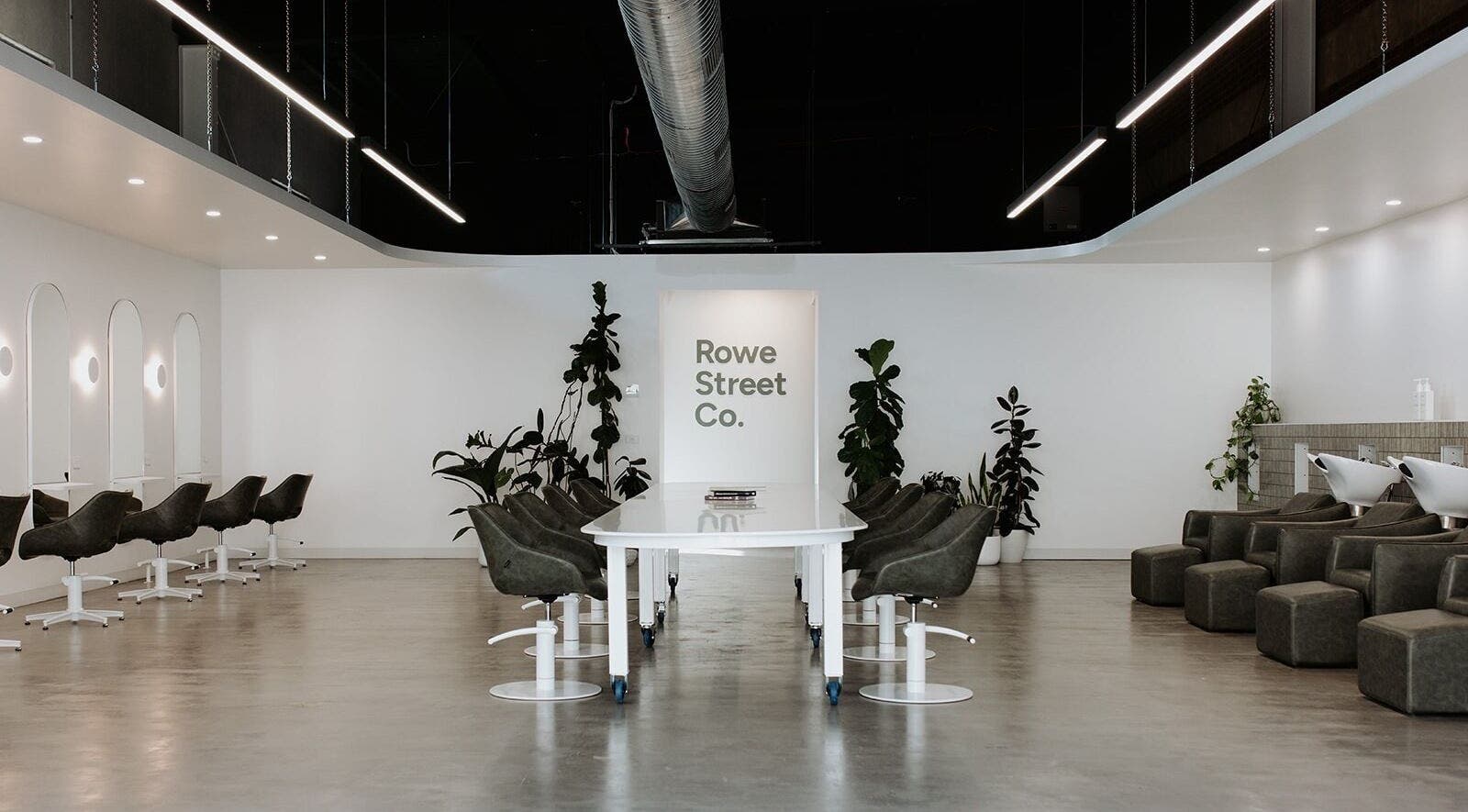 Modern interior of Rowe Street Co. in Shepparton, Victoria, AU with sleek chairs and minimalist decor.