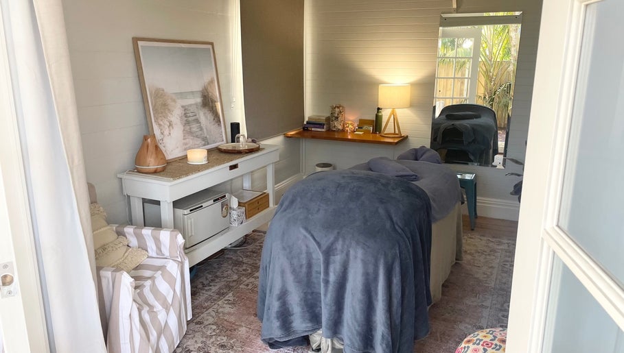 Cozy treatment room at Rebecca Orchard Remedial Massage in Hamilton, New South Wales, AU with a massage table.