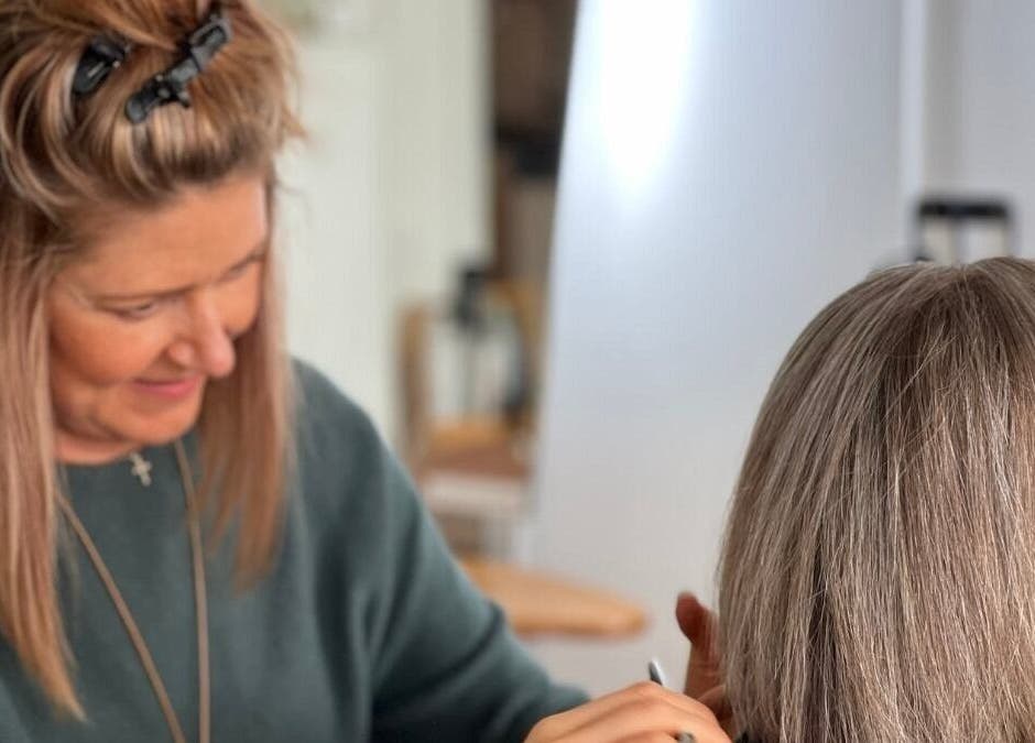 Stylist at Bardon Hair Design working on hair in Bardon, Queensland, AU.