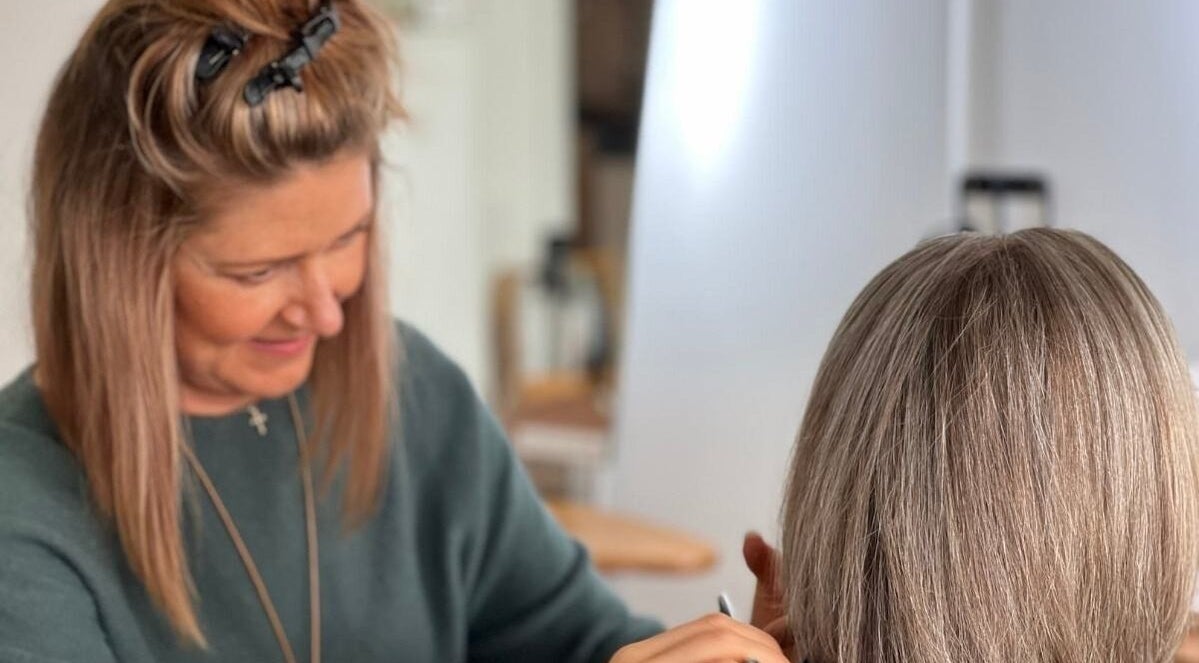 Stylist at Bardon Hair Design working on hair in Bardon, Queensland, AU.