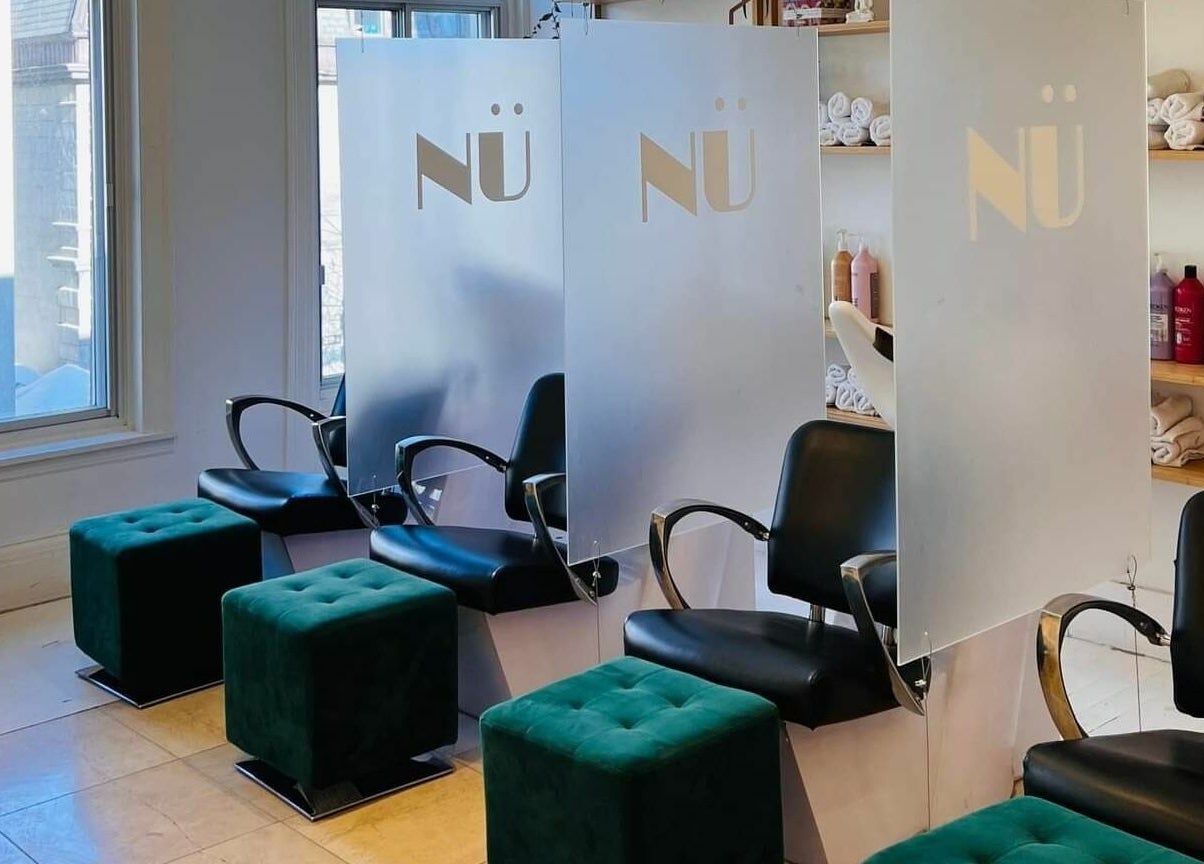 Elegant seating arrangement at Nu Salon, Montréal, Québec, CA showcasing modern design and comfort.