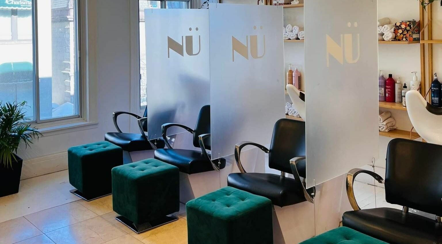 Elegant seating arrangement at Nu Salon, Montréal, Québec, CA showcasing modern design and comfort.