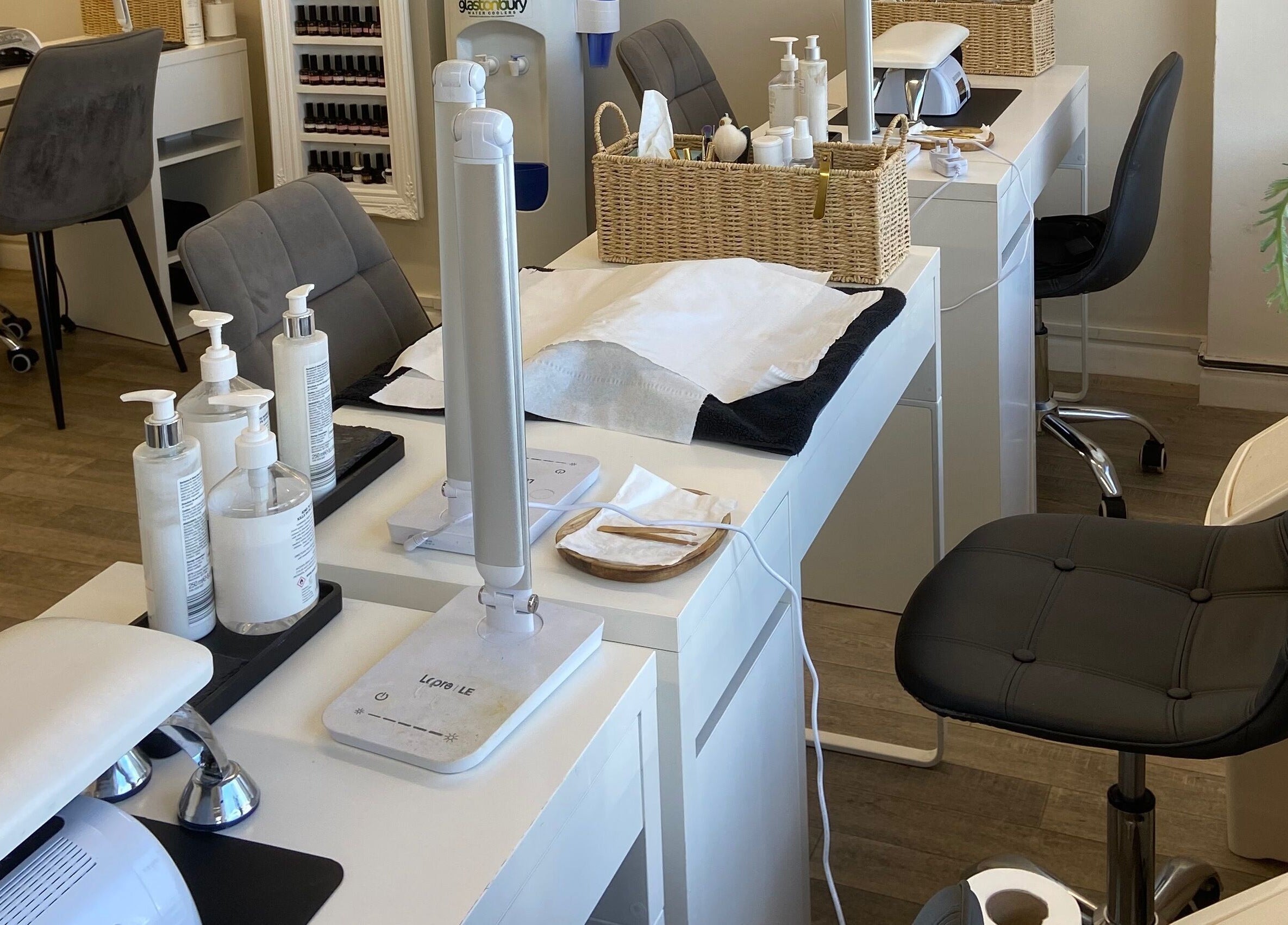 Elegant nail salon stations at Elm Tree Beauty in Westfield, England, GB, showcasing modern and tidy design.