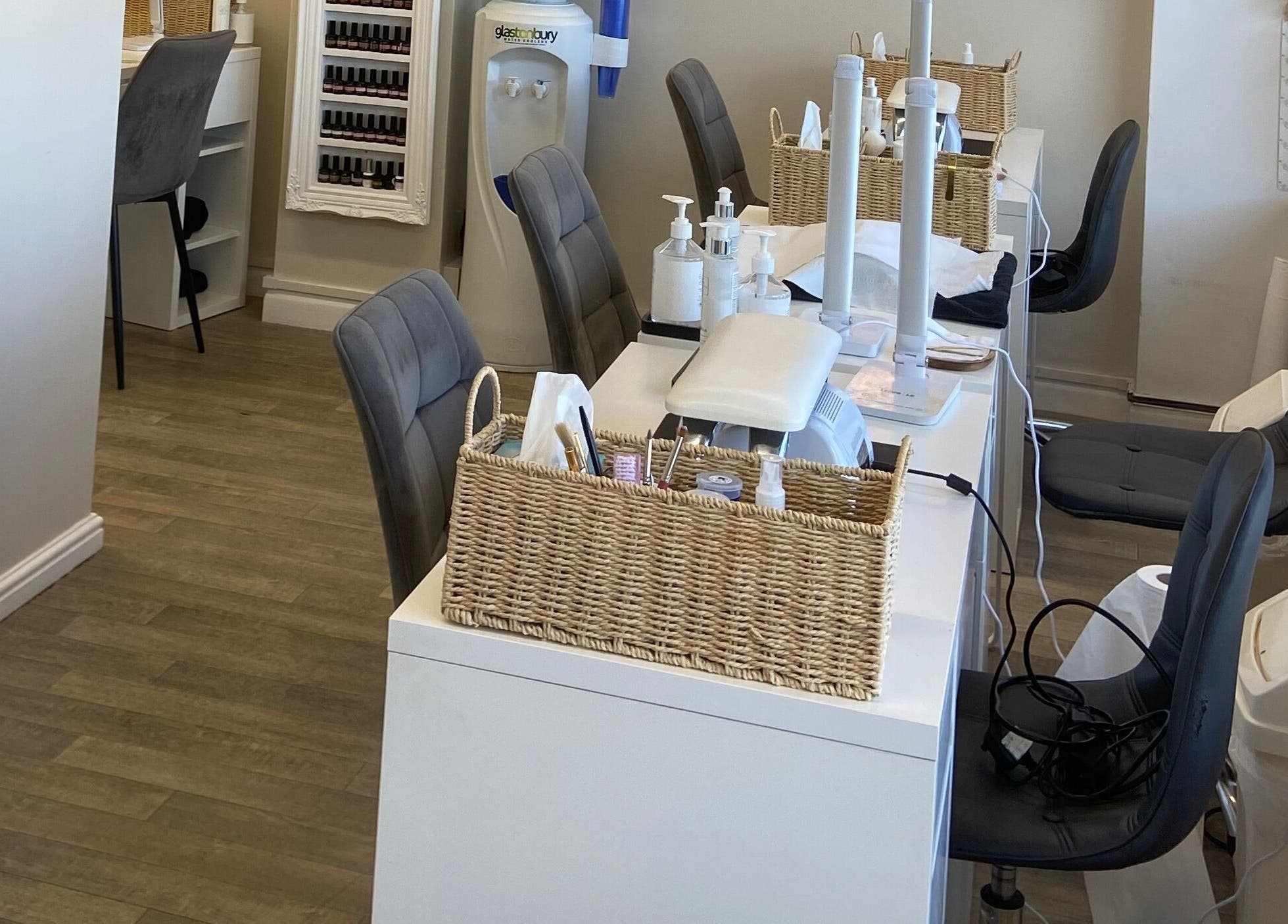 Modern nail station at Elm Tree Beauty in Westfield, England, GB with comfortable seating and tools.