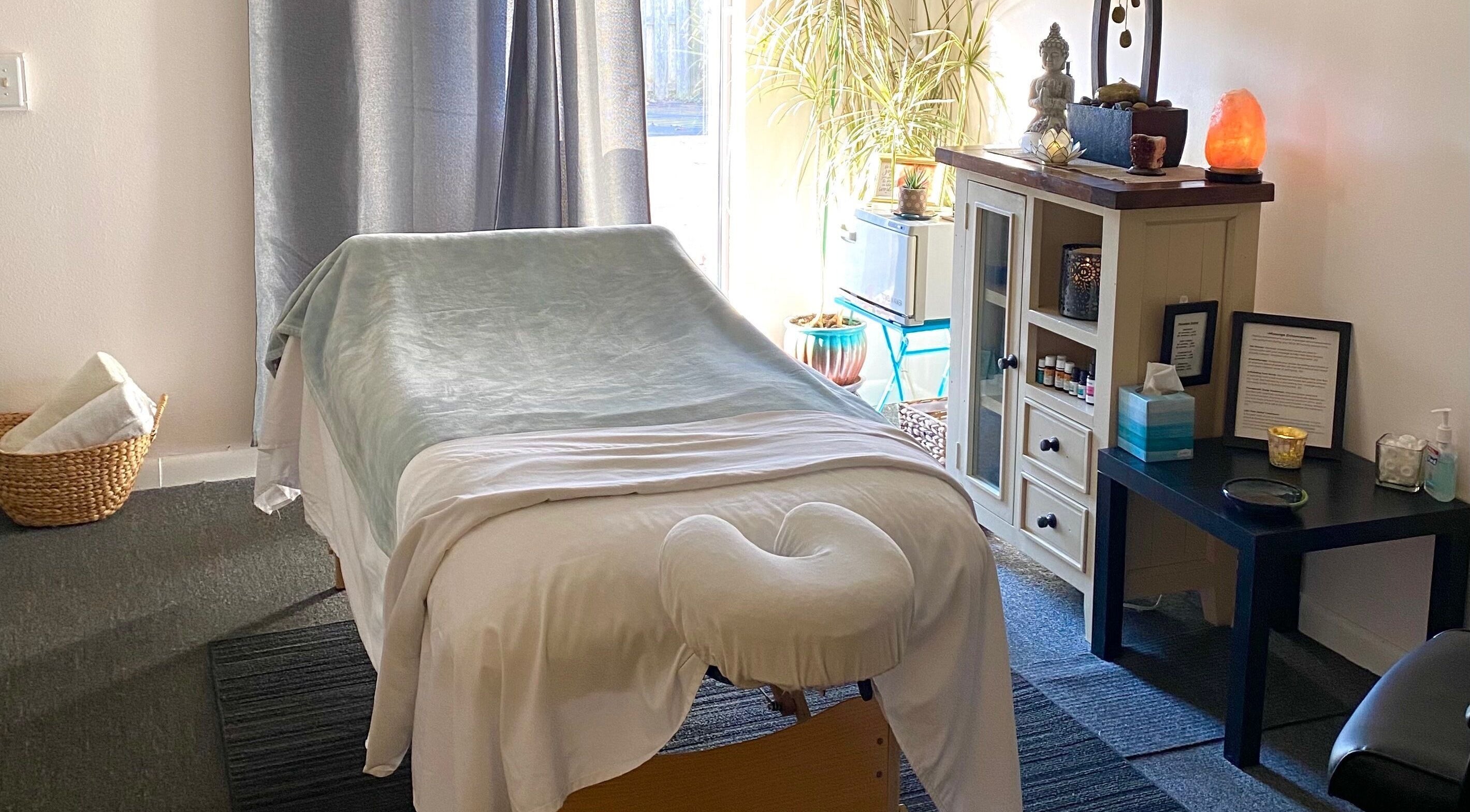 Peaceful massage room at Caroline Altmann Massage Therapy in St. Augustine, Florida, US, with calming decor.