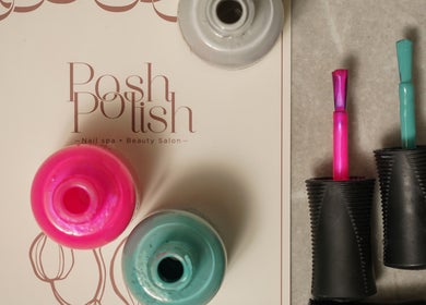 Nail polish bottles at Posh N Polish Nail Spa & Salon, Al Hofuf, Eastern Province, SA, showcasing vibrant colors.