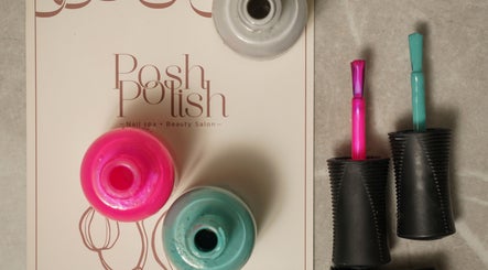Nail polish bottles at Posh N Polish Nail Spa & Salon, Al Hofuf, Eastern Province, SA, showcasing vibrant colors.