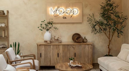 Mood Beauty Co. in Brant, Ontario, CA showcases a cozy, tranquil lounge with modern decor and natural accents.