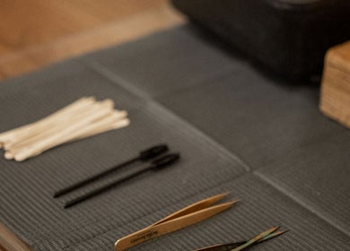 Beauty tools at Mood Beauty Co., Brant, Ontario, CA laid neatly on a mat for wellness treatments.