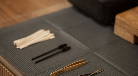 Beauty tools at Mood Beauty Co., Brant, Ontario, CA laid neatly on a mat for wellness treatments.