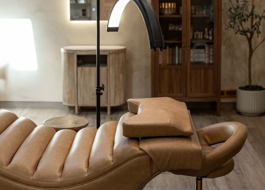 Luxurious treatment chair at Mood Beauty Co. in Brant, Ontario, CA, showcasing elegant interior design.