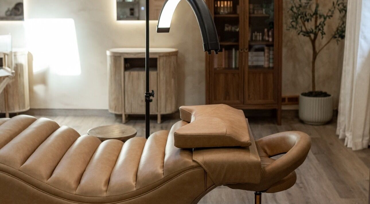 Luxurious treatment chair at Mood Beauty Co. in Brant, Ontario, CA, showcasing elegant interior design.