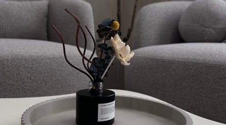Elegant reed diffuser on tray in cozy lounge at Lilynailsmater Carle Place, Carle Place, New York, US.