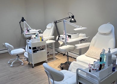 Lilynailsmater Carle Place venue in Carle Place, New York, US features modern nail and beauty chairs and tools.