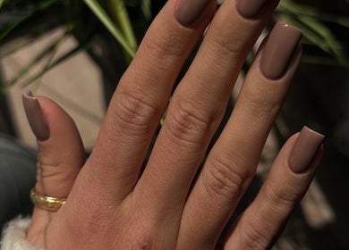 Elegant brown manicure at Lilynailsmater Carle Place, Carle Place, New York, US. Hand with stylish nails.