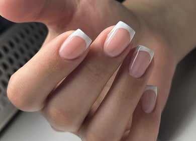 French manicure nails at Lilynailsmaster Carle Place, Carle Place, New York, US, showcasing elegant nail artistry.