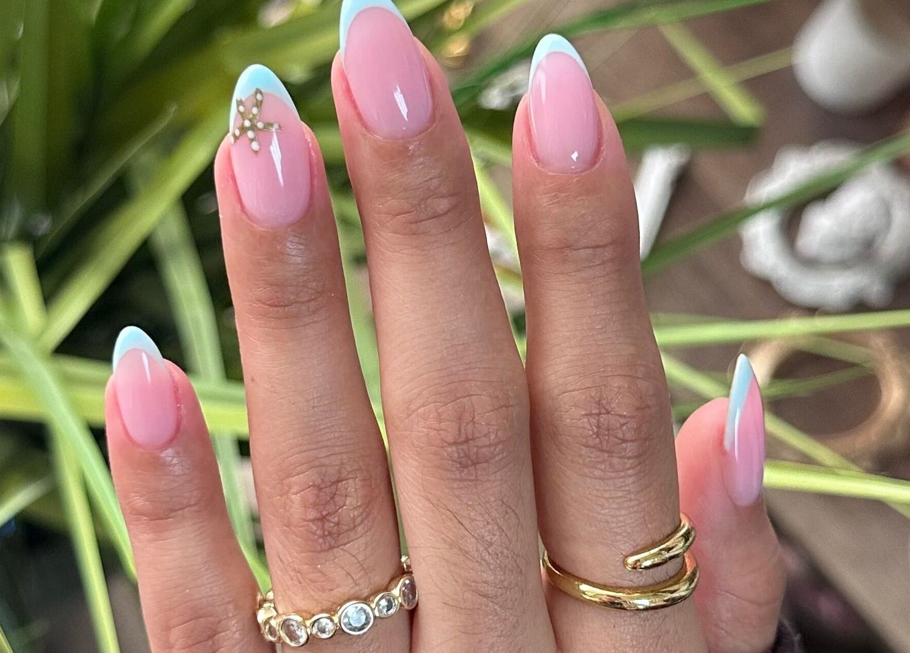 Stylish pink and blue French manicure at Lilynailsmaster Carle Place, Carle Place, New York, US.