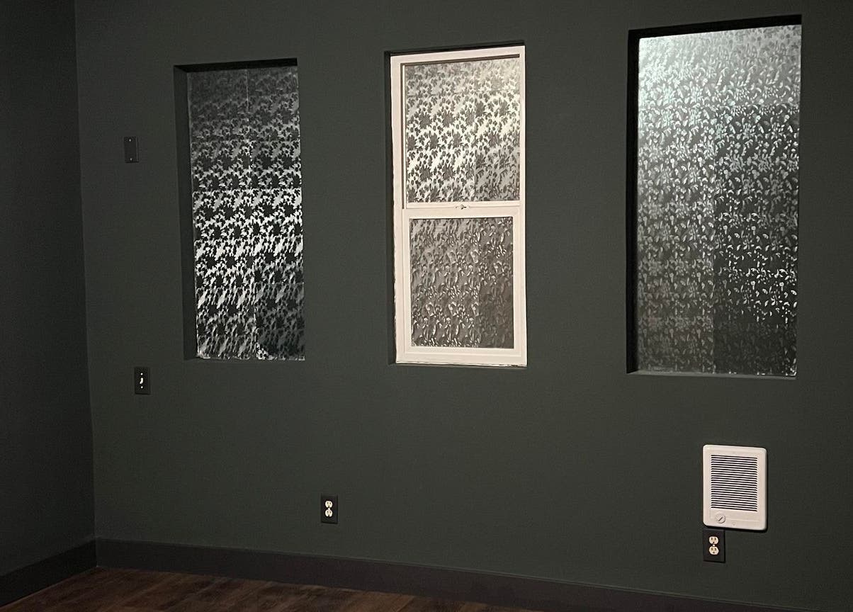 Decorative glass windows in Elfin Spa Fairy, Orem, Utah, US create a serene atmosphere.