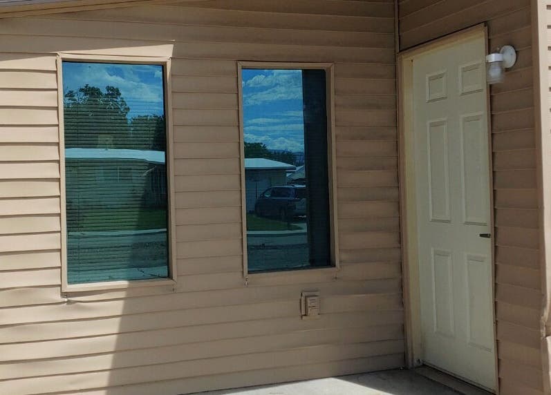 Exterior entrance of Elfin Spa Fairy in Orem, Utah, US with sunny reflections.