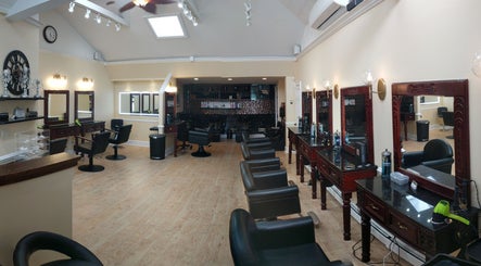 Elegant interior of Salon Posh & DeCara Makeup, Mamaroneck, New York, US showcasing stylish seating and mirrors.