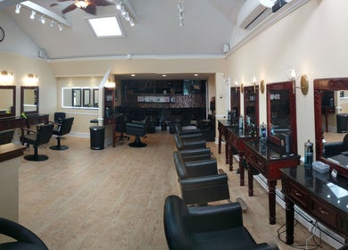 Elegant interior of Salon Posh & DeCara Makeup, Mamaroneck, New York, US featuring stylish salon chairs and mirrors.