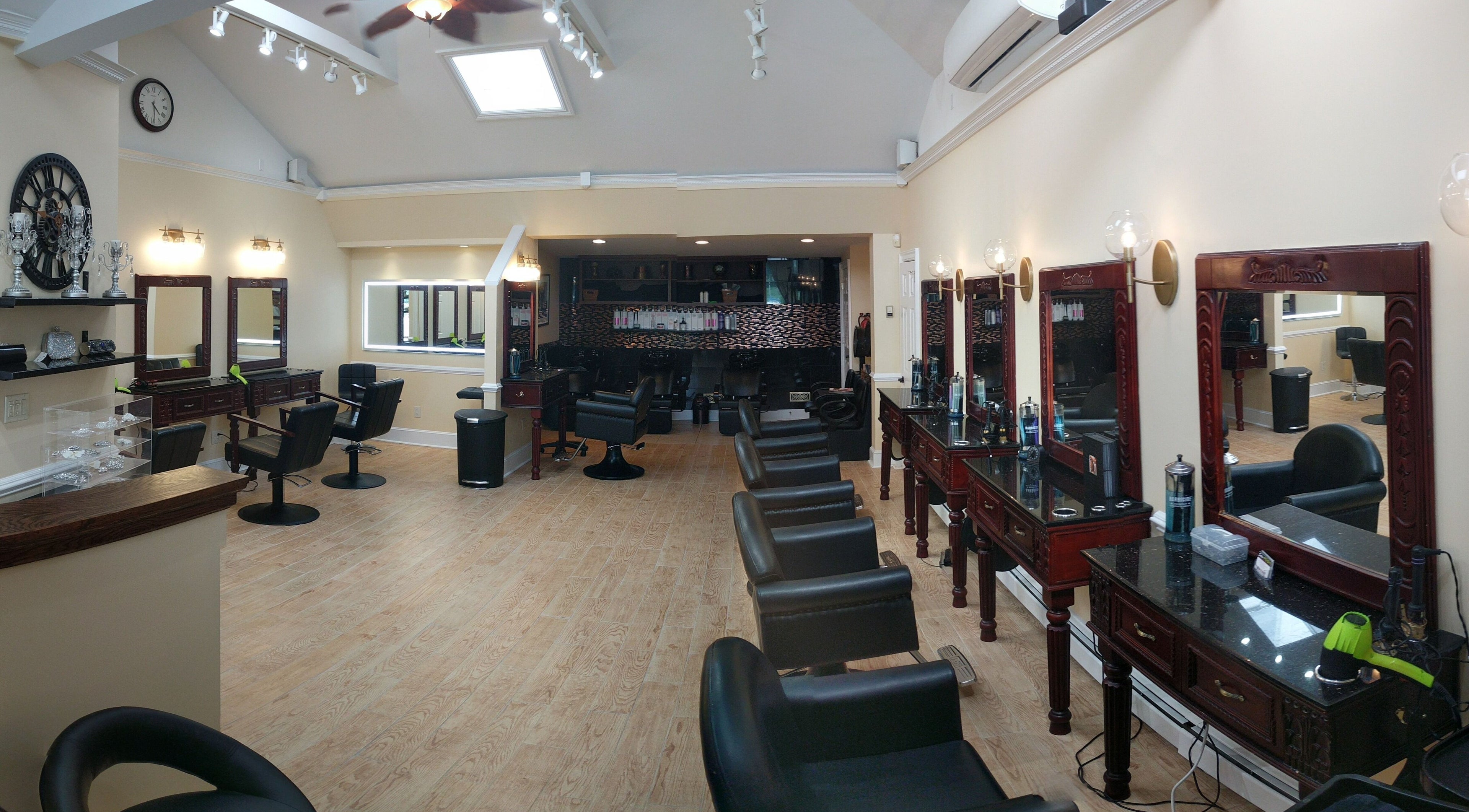 Elegant interior of Salon Posh & DeCara Makeup, Mamaroneck, New York, US featuring stylish salon chairs and mirrors.