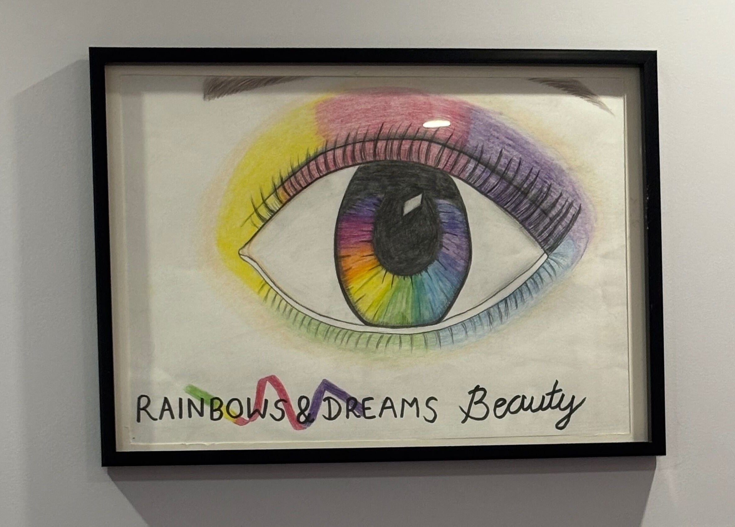 Framed rainbow eye sketch at Rainbows and Dreams Beauty, Watford, England, GB.