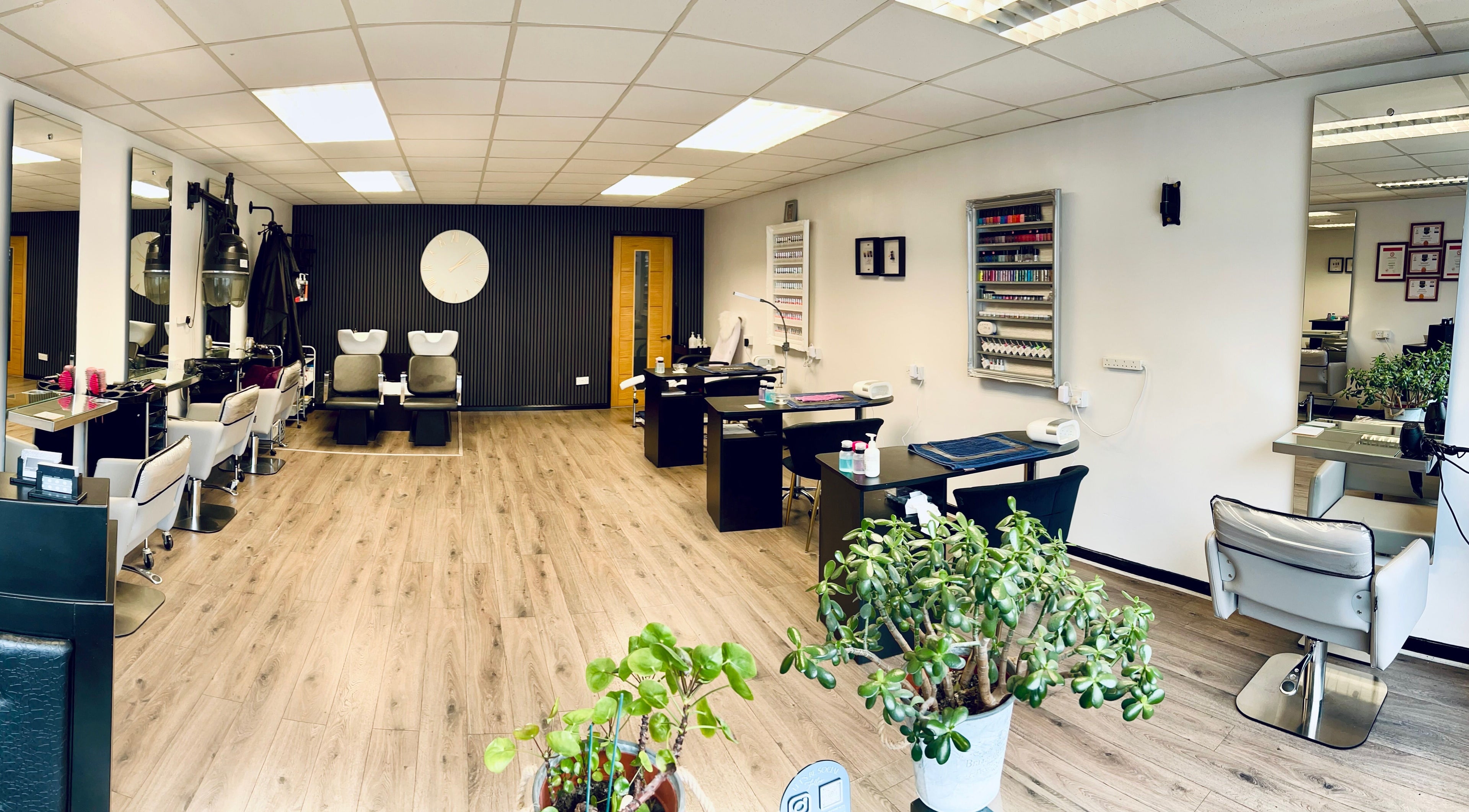 Spacious AP Hair & Beauty salon in Hednesford, England, GB with modern chairs and elegant decor.