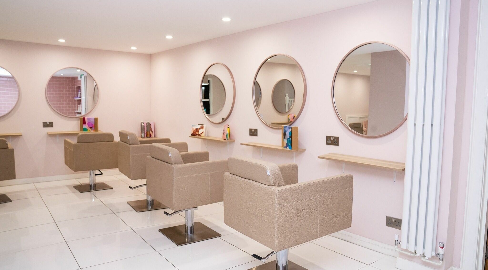 Elegant salon interior at BeautytoPerfection, Musselburgh, Scotland, GB featuring stylish mirrors and seating.