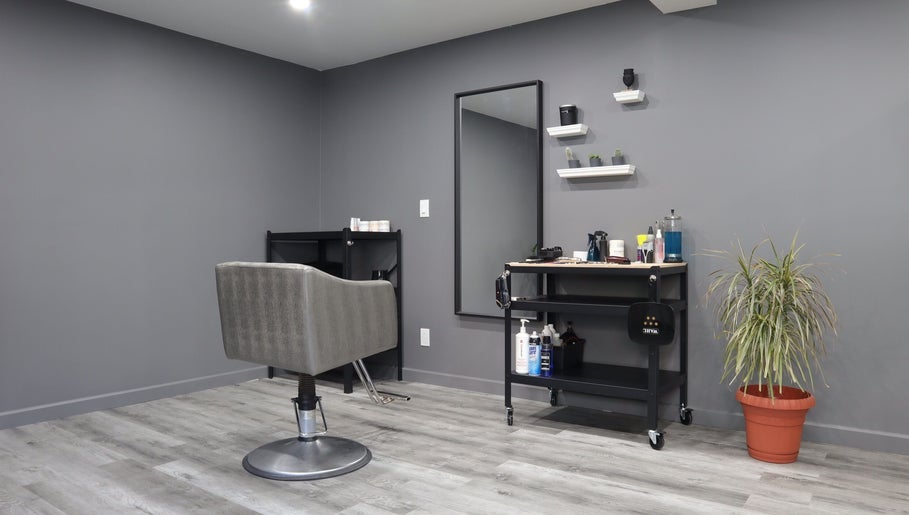 Modern hair salon chair and tools at The Spot, Montréal, Québec, CA offering a stylish ambience for beauty treatments.
